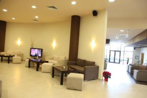 a lobby with couches and a tv in a building at F307 Studio Aspen Golf Resort Bansko in Bansko