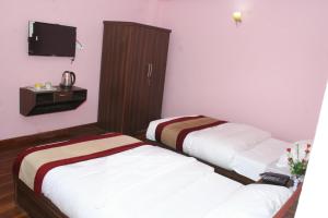 Postel nebo postele na pokoji v ubytování Sitapaila Home Stay and Apartment