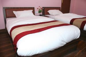 Postel nebo postele na pokoji v ubytování Sitapaila Home Stay and Apartment