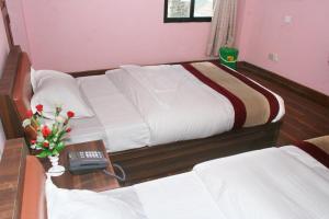 Postel nebo postele na pokoji v ubytování Sitapaila Home Stay and Apartment