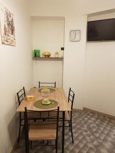 a dining room with a table and chairs at Casa Alessia Sanremo in Sanremo