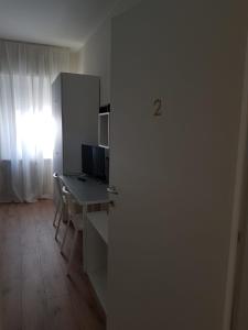 TV a/nebo společenská místnost v ubytování Affittacamere Risorgimento