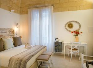 A bed or beds in a room at Amatè Suite
