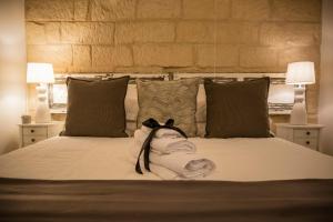 A bed or beds in a room at Amatè Suite
