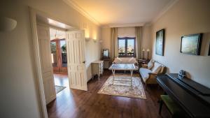 a living room with a couch and a table at Cigarral de la Encarnación in Toledo