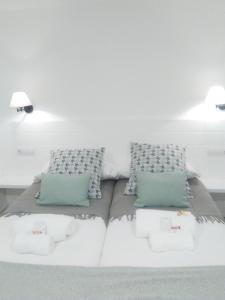 Posteľ alebo postele v izbe v ubytovaní Apartamento El Reloj