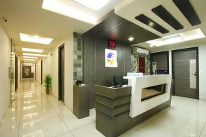 an office with a reception desk in a lobby at Hotel Flair Inn in Ahmedabad