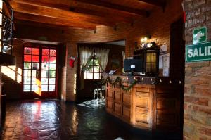 a lobby of a building with a sign on the wall at Posada Alpenrose Neu in Villa Carlos Paz