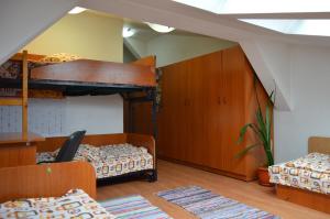 a room with two bunk beds in a room at Kollege Hostel in Cluj-Napoca