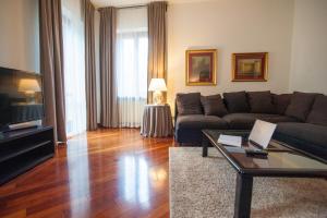 a living room with a couch and a table at Italianflat - Via Mazzini in Verona