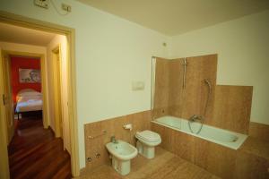 a bathroom with a toilet and a shower and a sink at Italianflat - Via Mazzini in Verona +21 photos