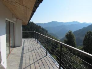a balcony of a house with a view of mountains at Borislav's Farmhouse in Ogled