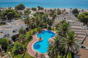 an aerial view of a resort with a swimming pool and the beach at ARENDA Pino Alto Holiday Home Martin 18 in Miami Platja