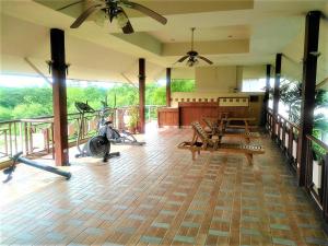 a fitness room with a gym with a treadmill and a treadmill at Star of Hin Nam Condominium in Hua Hin