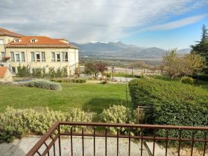 a view of a house from a balcony at Hotel Sierra Oriente in Guadarrama