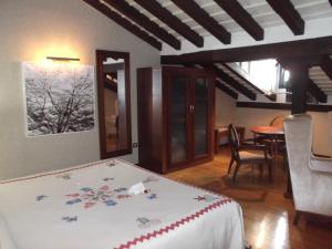 Postel nebo postele na pokoji v ubytování Hotel Termal Abadia de Los Templarios