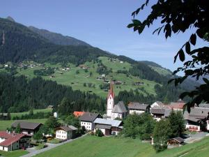 a small village with a church on a hill at Gästehaus Ortner in Liesing