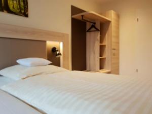 Postel nebo postele na pokoji v ubytování Hotel Clemenswerther Hof