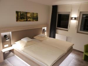 Postel nebo postele na pokoji v ubytování Hotel Clemenswerther Hof