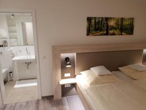 Postel nebo postele na pokoji v ubytování Hotel Clemenswerther Hof