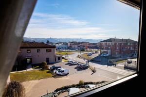 a view from a window of a parking lot at Castahotel in Guarene