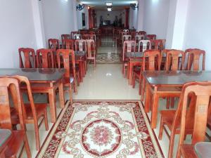 an empty dining room with tables and chairs at Quoc Thai Sapa Hotel in Sapa