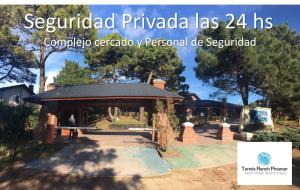 a pavilion in a park with a person sitting on a bench at Tennis Ranch Pinamar in Pinamar