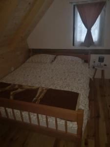 Postel nebo postele na pokoji v ubytování Brvnare Krstigora