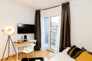 Μια τηλεόραση ή/και κέντρο ψυχαγωγίας στο Apart Hotel Messe Munich - my room Apartments