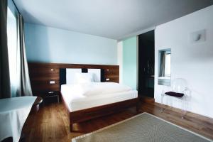Frühstückshotel im Goldschmiedehaus客房内的一张或多张床位