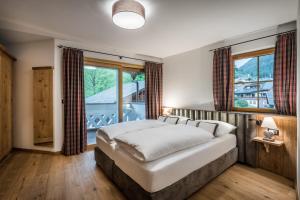 Posteľ alebo postele v izbe v ubytovaní Alpenhotel Plaza