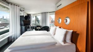 Ein Bett oder Betten in einem Zimmer der Unterkunft Penck Hotel Dresden