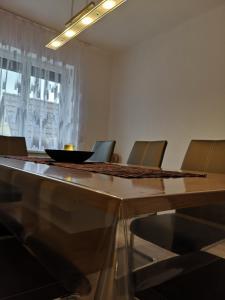 a dining room table with a bowl on top of it at Ferienwohnung Elias in Merseburg