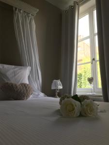 Uma cama ou camas num quarto em B&B Le Cloître St Joseph