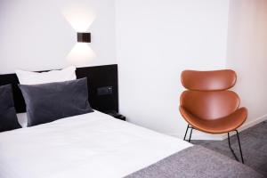 Postel nebo postele na pokoji v ubytování Hotel Carnac