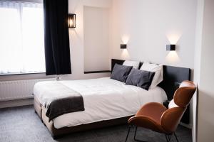 Postel nebo postele na pokoji v ubytování Hotel Carnac