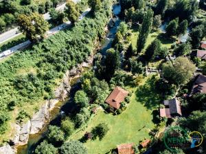 an aerial view of a house and a river at Guest House Nena Rastoke - Nature Retreat with waterfall views in Slunj