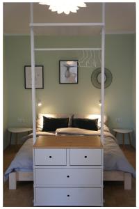 a bedroom with a bed and a dresser at Best Choice Terrace FREE Parking in Graz