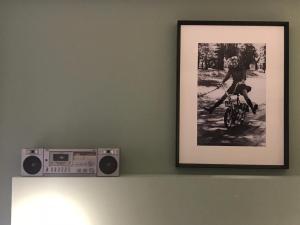 a picture of a person riding a bike on a wall at Hôtel Le G (ex Le Genève) in Nice