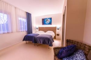 Katil atau katil-katil dalam bilik di ManavaHotel