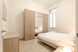 En eller flere senge i et værelse på S.Felice Apartments