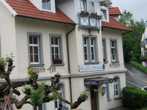 a white building with a red roof at Schützen Hotel Meersburg Bed & Breakfast in Meersburg