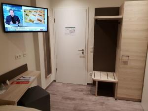 TV a/nebo společenská místnost v ubytování Hotel Clemenswerther Hof