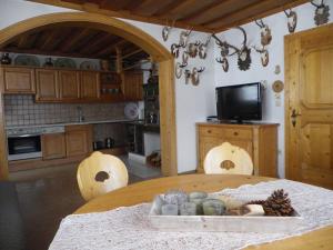 a kitchen with a table with a bowl of food on it at Landhaus Weiss in Sankt Martin am Tennengebirge