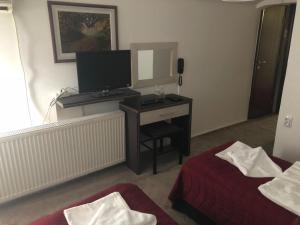 Llit o llits en una habitació de Gros Hotel - Leskovac