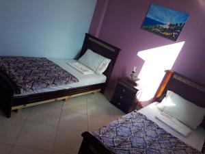 Uma cama ou camas num quarto em TanjaLucia Hostel