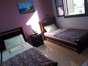 Uma cama ou camas num quarto em TanjaLucia Hostel