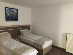 Llit o llits en una habitació de Gros Hotel - Leskovac