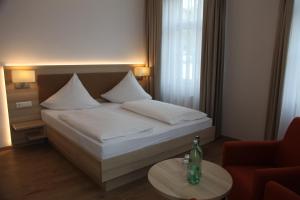 Voodi või voodid majutusasutuse Schützen Hotel & ConceptStore toas