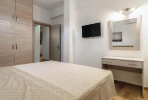 Postel nebo postele na pokoji v ubytování Oresteia Downtown Apartment